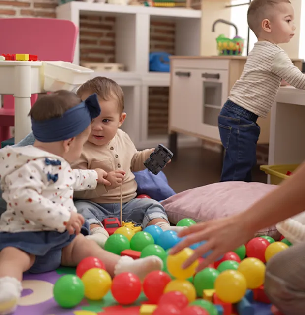 childcare-programs-near-renton-toddlers-playing-steam.jpg Toddlers exploring toys and interacting in a nurturing childcare program near Renton