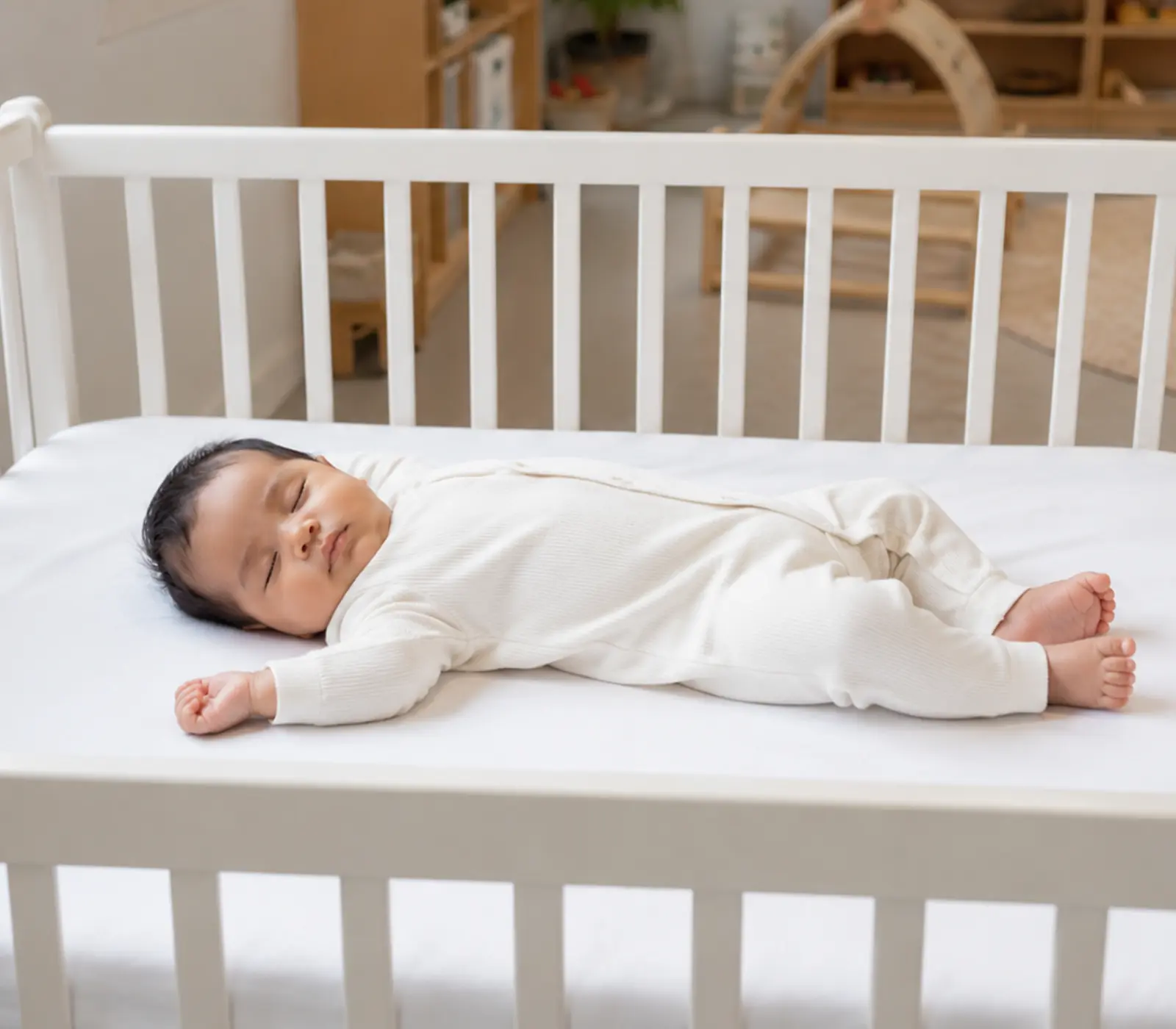 Safe Infant Sleep in Daycare Crib Infant sleeping safely on their back in a daycare crib